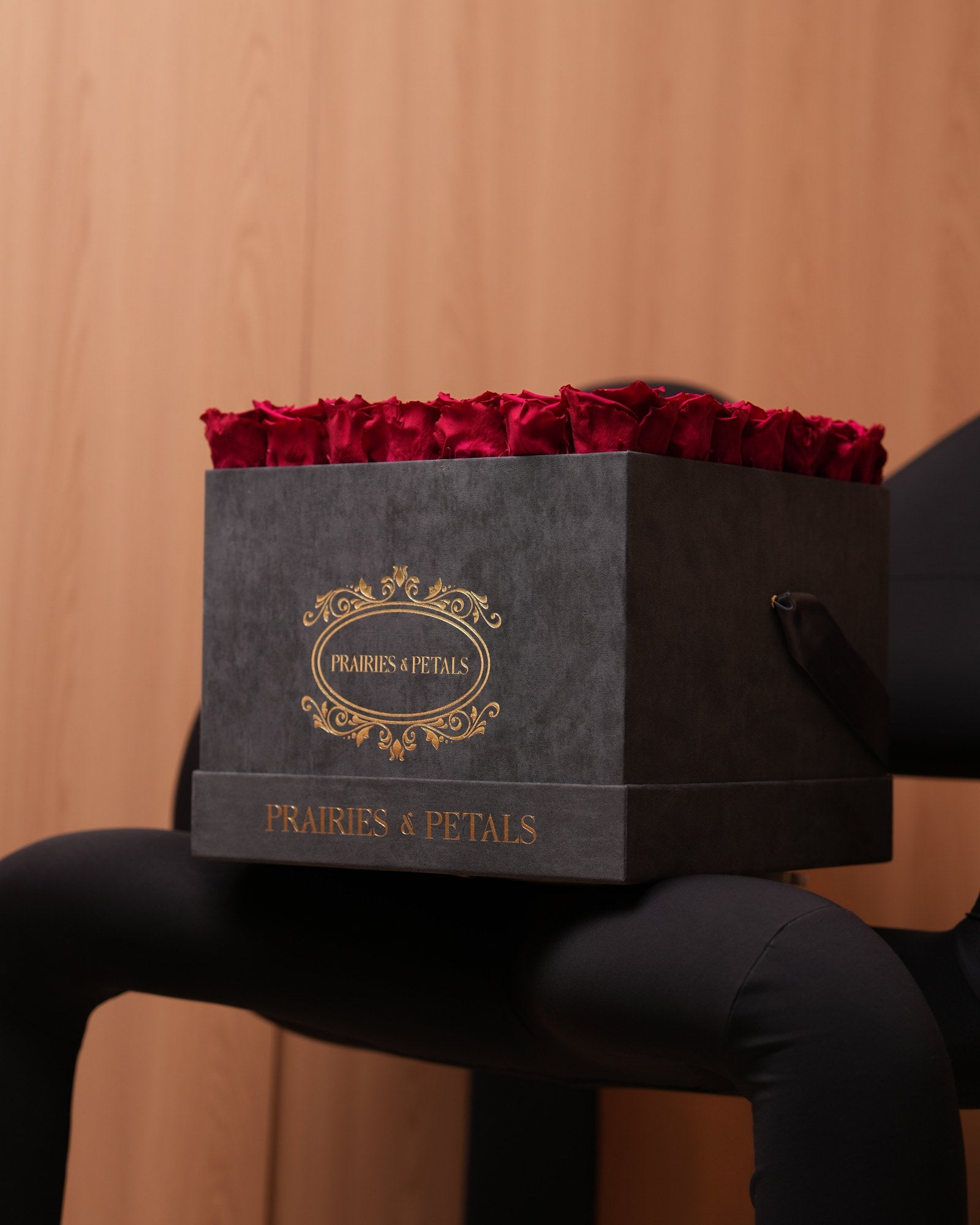 Burgundy roses in a black velvet Prairies & Petals square box